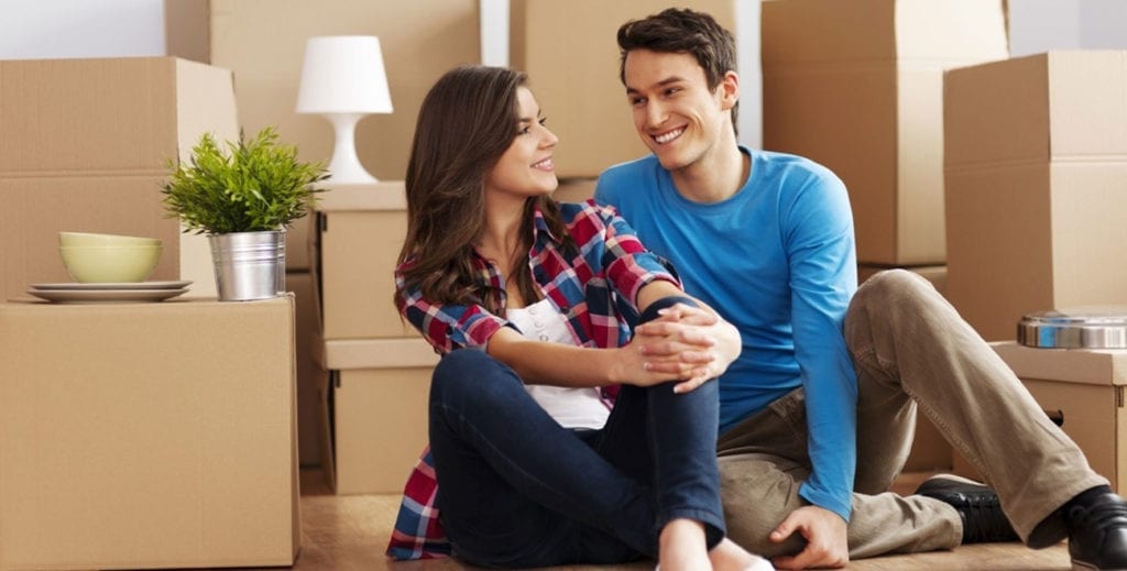 Happy Couple with Moving Boxes