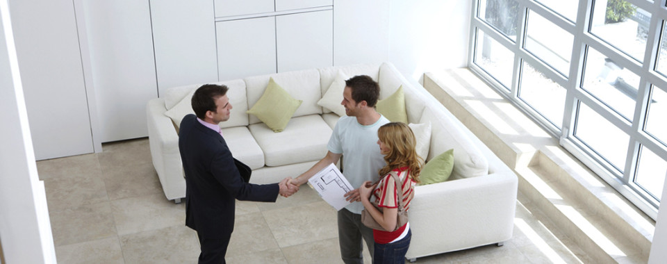 Realtor Shaking Hands with Potential Buyers